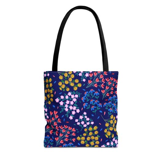 Floral Night Garden Tote with black straps showcases a navy-blue backdrop adorned with vibrant floral patterns, embodying FireBrook Essentials' commitment to joyful, stylish, and practical design.