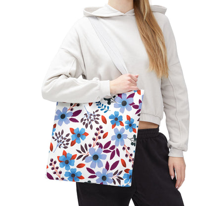Floral Tote Bag with vibrant blue and purple flowers, carried over the shoulder. Ideal for summer outings, this stylish accessory from FireBrook Designs combines functionality with cheerful, uplifting design.