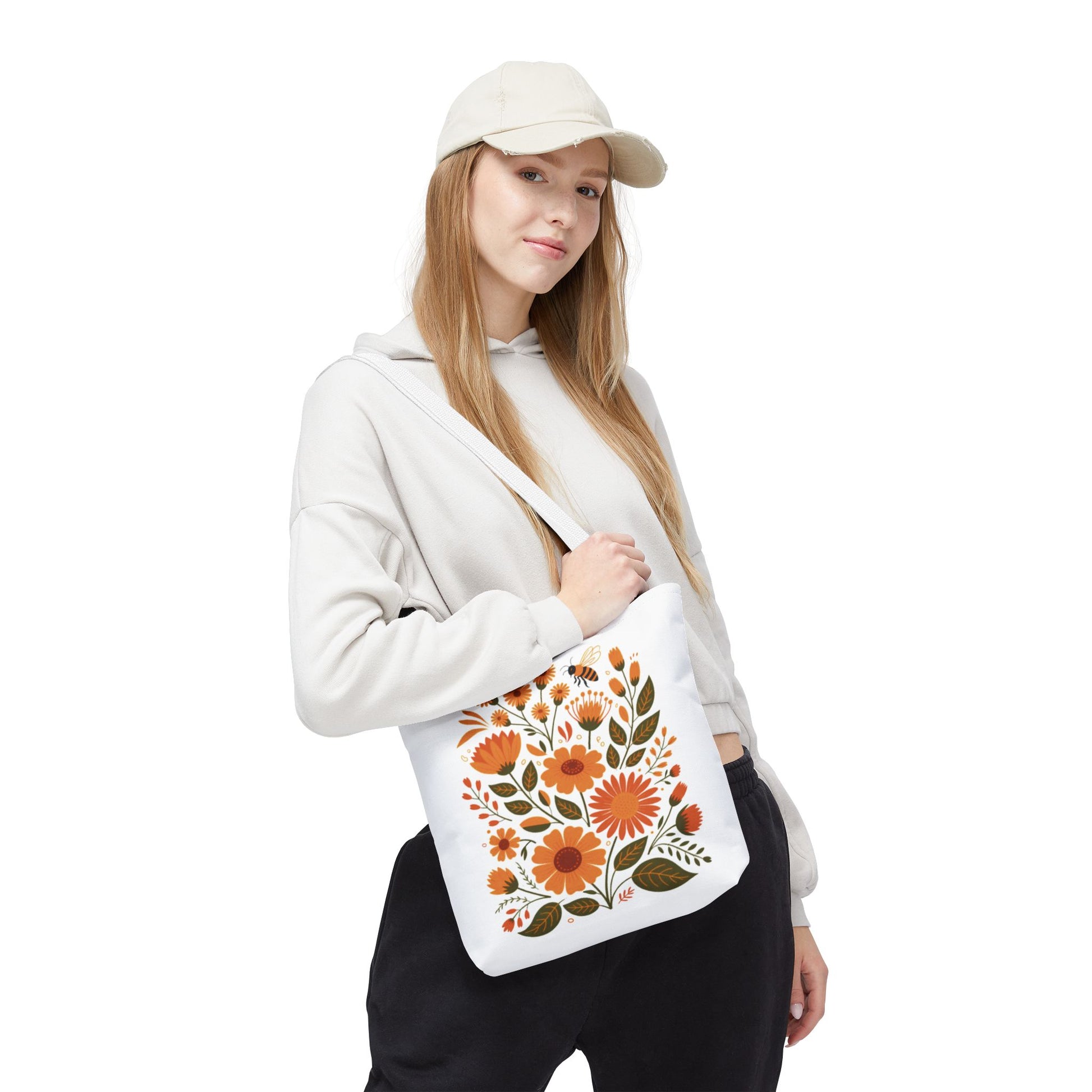 Folk Floral Tote Bag showcasing vibrant hand-drawn wildflowers, ideal for nature lovers. Crafted from durable polyester with reinforced handles, perfect for daily use or gifting for nature-themed occasions.