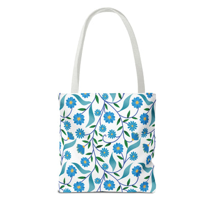 Blue Floral Tote Bag featuring a vibrant botanical pattern of blue flowers and green leaves on white. Perfect for summer outings, this durable tote embodies FireBrook Designs' joyful and stylish essence.