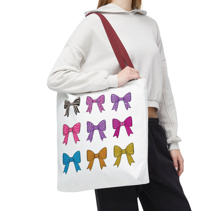 Woman holding the Bows Ribbons Tote Bag, featuring playful bow prints, designed for style and practicality with spacious compartments and durable construction.