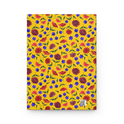 Floral Pattern Hardcover Journal — Bright Yellow Wildflower Notebook features a vibrant mustard-yellow cover with hand-drawn red, pink, and blue flowers. A small barcode blends into the cheerful design.