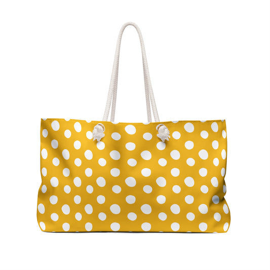 Polka Dot Weekender Bag with yellow and white pattern, featuring cream rope handles and gold grommets. Spacious and stylish, ideal for short trips, aligning with FireBrook Essentials' joyful design philosophy.