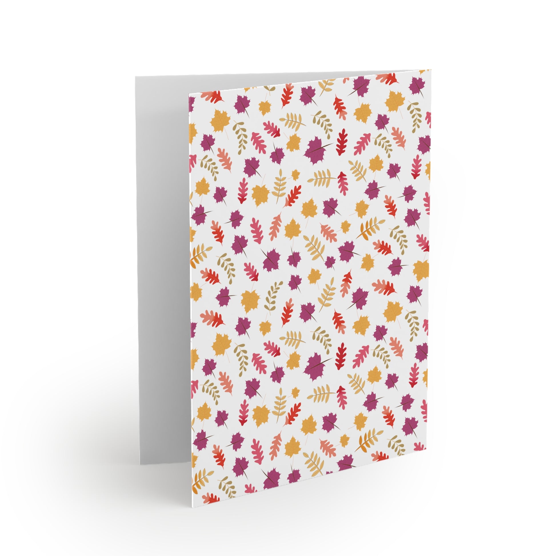 Autumn Greeting Cards — Pack of 8/16/24: A folded card shows a blank interior and a cover adorned with vibrant autumn leaves, embodying FireBrook Essentials' uplifting design ethos. Each card includes a matching white envelope.