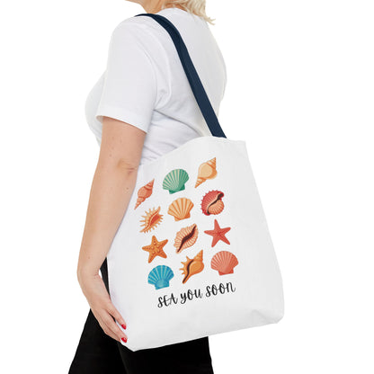Sea You Soon Sea Shells Tote Bag with beachy design, featuring sea shells and summery vibe. Ideal for ocean lovers, made of durable polyester, with reinforced handles and boxed corners.