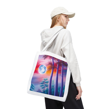 Moonlit Forest Tote Bag features a mystical full moon scene with towering trees against a dramatic sunset sky, perfect for art lovers. Durable 100% polyester, available in three sizes with customizable handles.