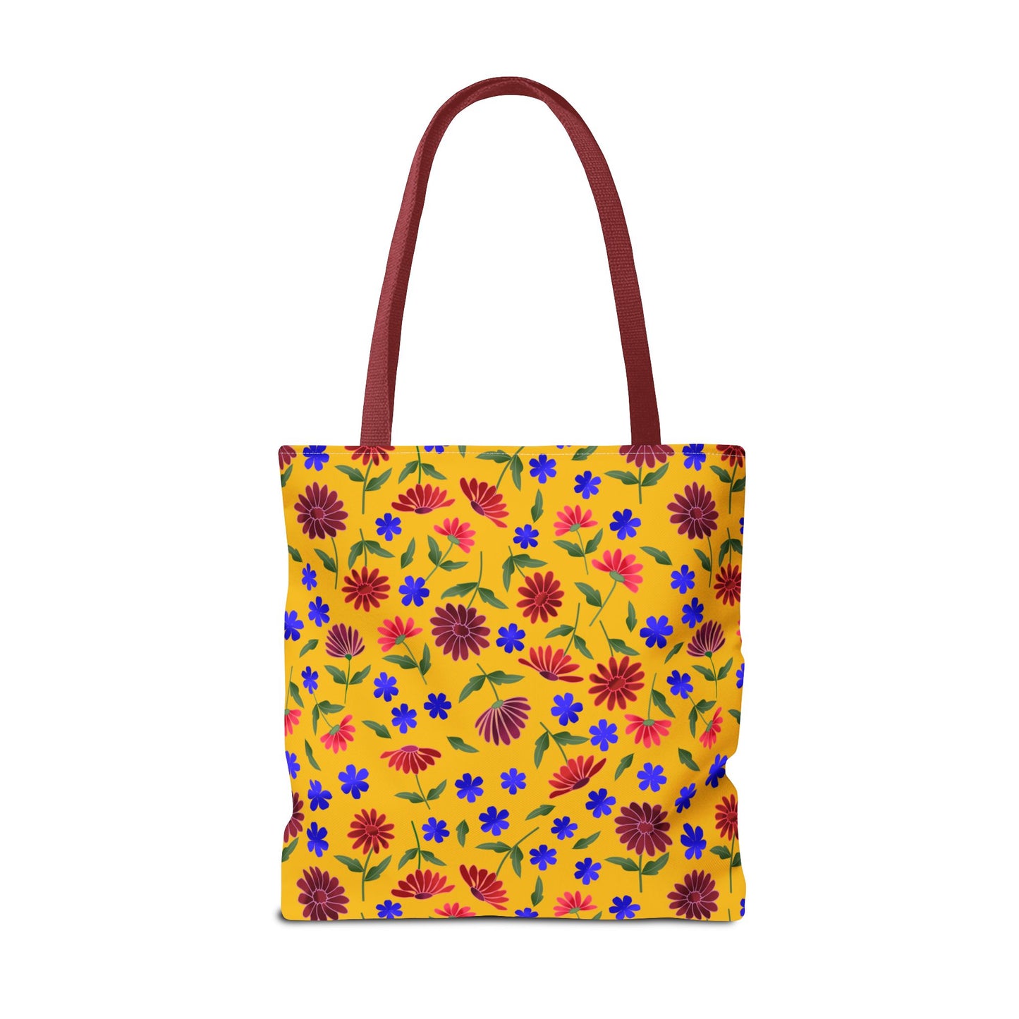 Golden Wildflower Tote Bag featuring a warm golden-yellow canvas with vibrant red and pink daisies, small blue flowers, and green leaves; deep reddish-maroon handles add a stylish, durable touch.