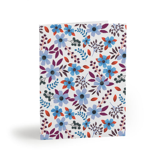 Floral Greeting Cards — Pack of 8/16/24, featuring a vibrant, hand-drawn botanical pattern with blue and lavender flowers, purplish-red leaves, and dark berries on a white background, embodying joyful, fresh design.