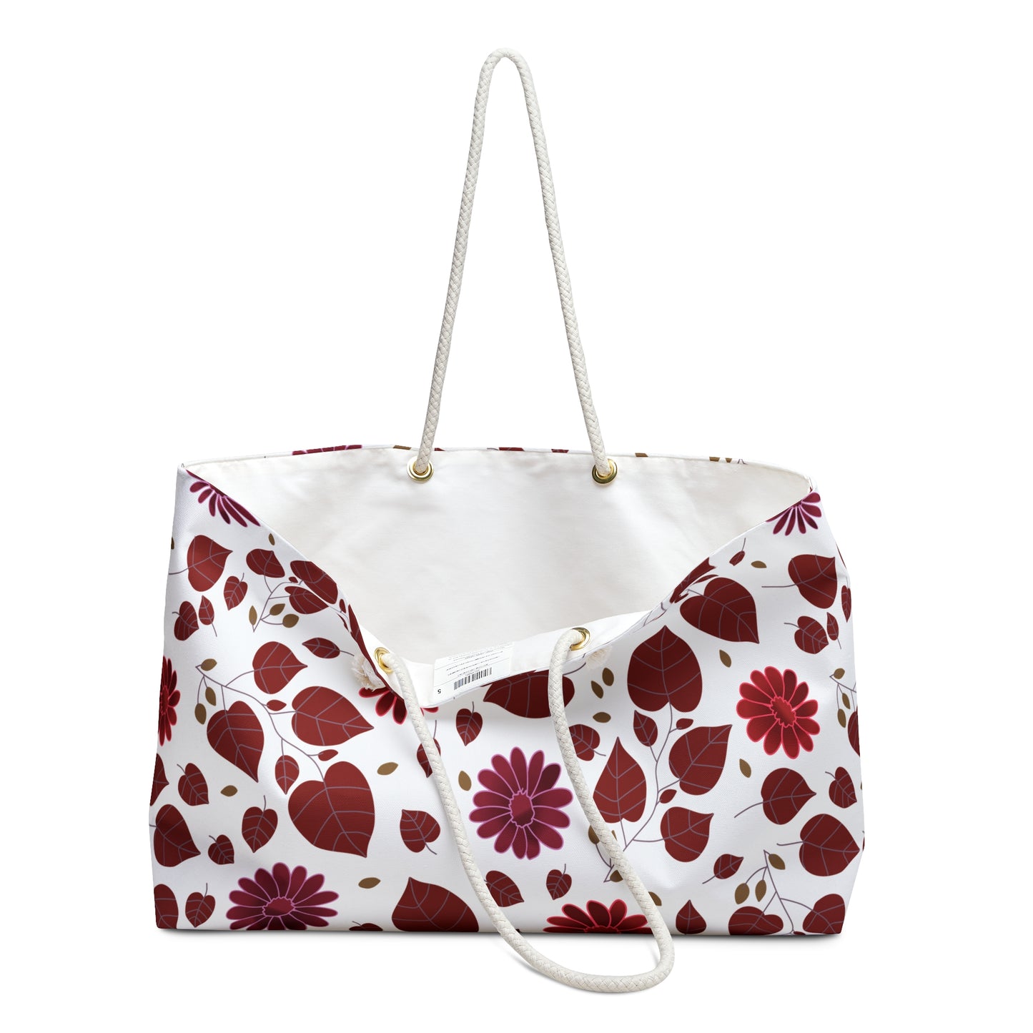 Weekender Bag with white rope handles and a T-bottom design, featuring a vibrant red and burgundy leaf and daisy pattern. Ideal for stylish travel, embodying FireBrook Designs' joyful and uplifting spirit.