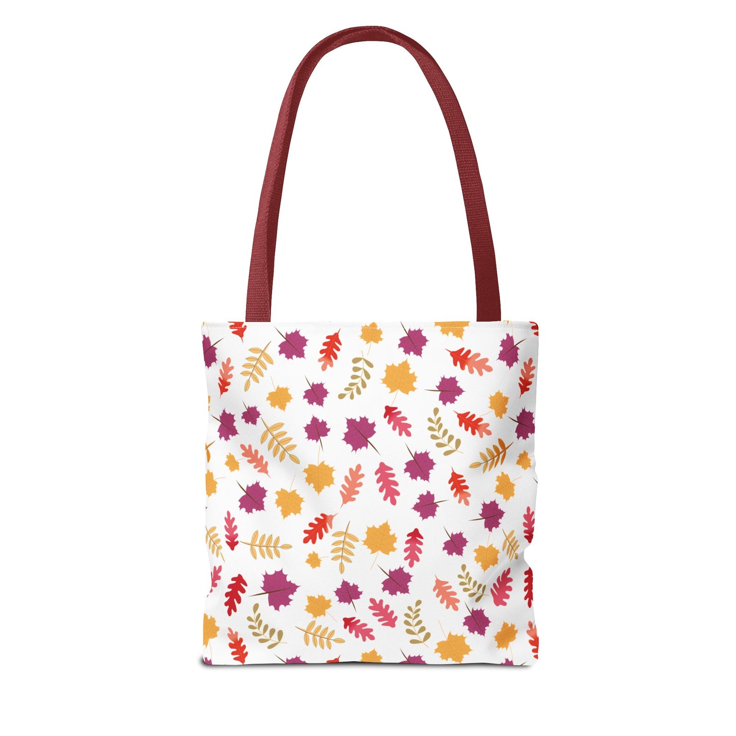 Autumn Leaves Tote Bag from FireBrook Designs features a white body with a vibrant pattern of stylized autumn leaves, burgundy handles, and reinforced stitching for durability, perfect for daily essentials.
