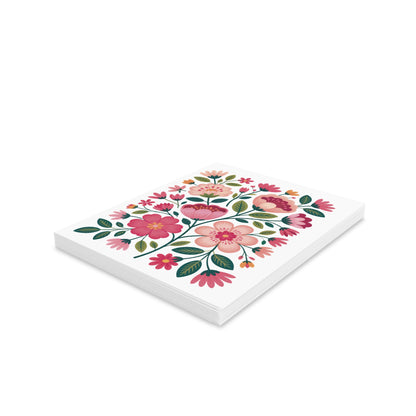 Flower Greeting Cards — Pack of 8/16/24 features a stack of square cards adorned with a vibrant botanical motif of pink and peach flowers and green leaves, embodying cheerful, garden-inspired elegance.