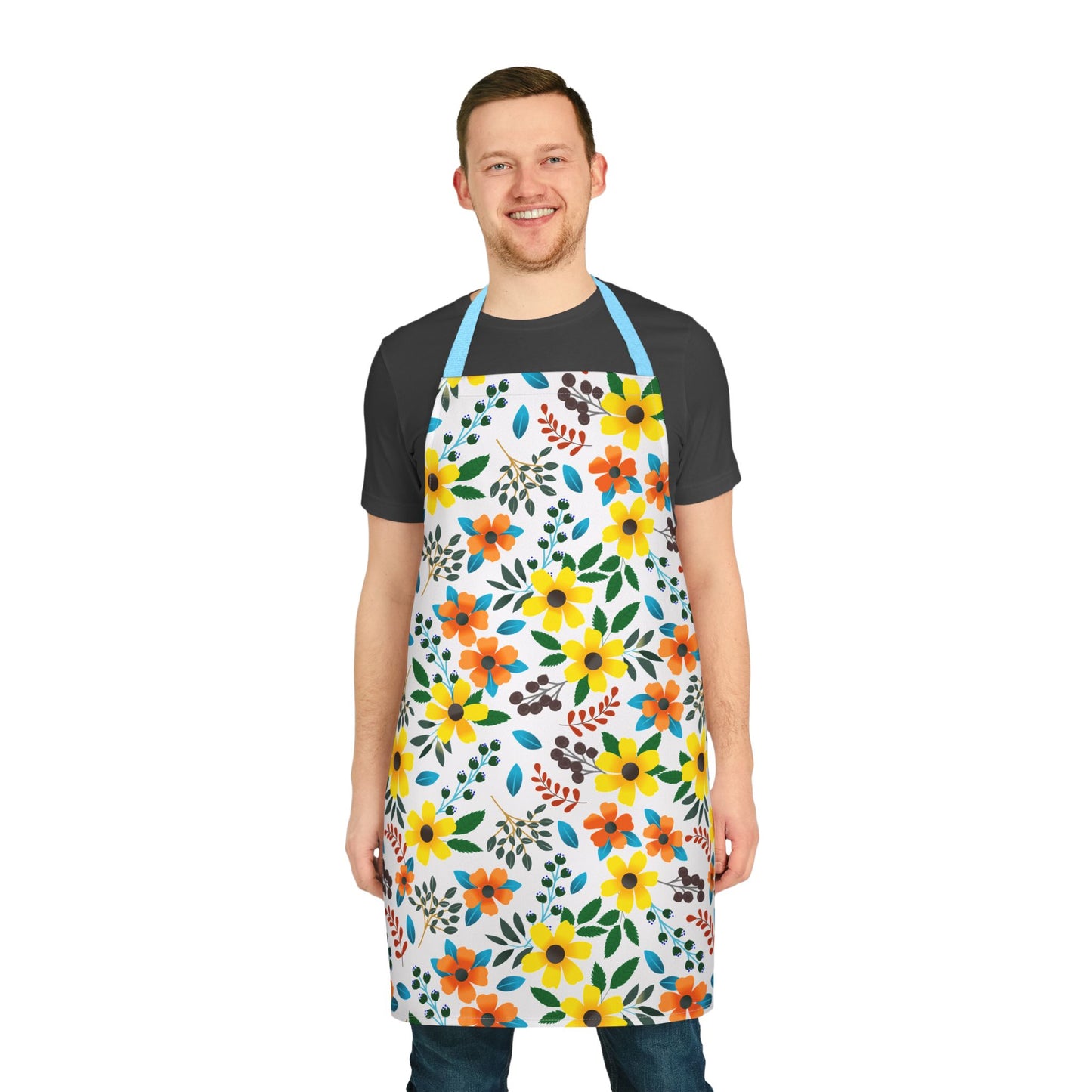 The Floral Apron features vibrant stylized flowers and leafy sprigs, worn by a smiling model. This stain-free, comfortable, and stylish apron embodies FireBrook Essentials' commitment to uplifting, joyful designs.