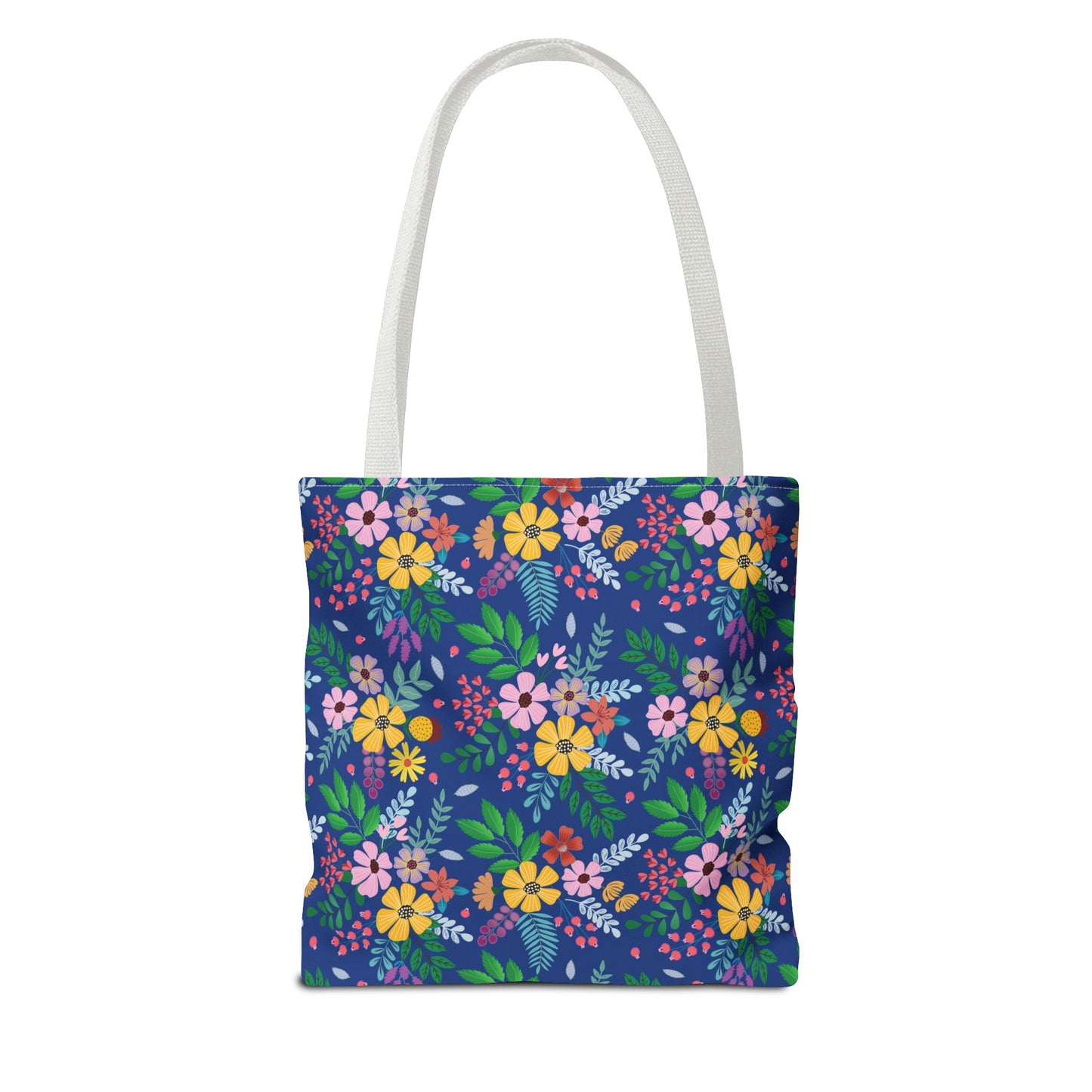 Floral Tote Bag featuring a vibrant, all-over floral pattern with stylized flowers and foliage on a navy-blue background, complemented by white handles. Ideal for cheerful summer outings or trips.