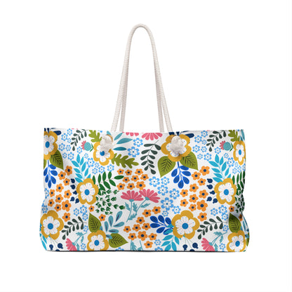 Weekender Bag with a vibrant floral pattern on a white background, featuring thick white rope handles and a spacious design, ideal for stylish travel and overnight stays, embodying FireBrook Designs' uplifting aesthetic.