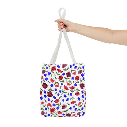 Floral Pattern Tote Bag — Red & Blue Wildflower All-Over Print: A white tote with vibrant floral designs held by a hand with red nails, showcasing its roomy, stylish, and durable features perfect for everyday use.