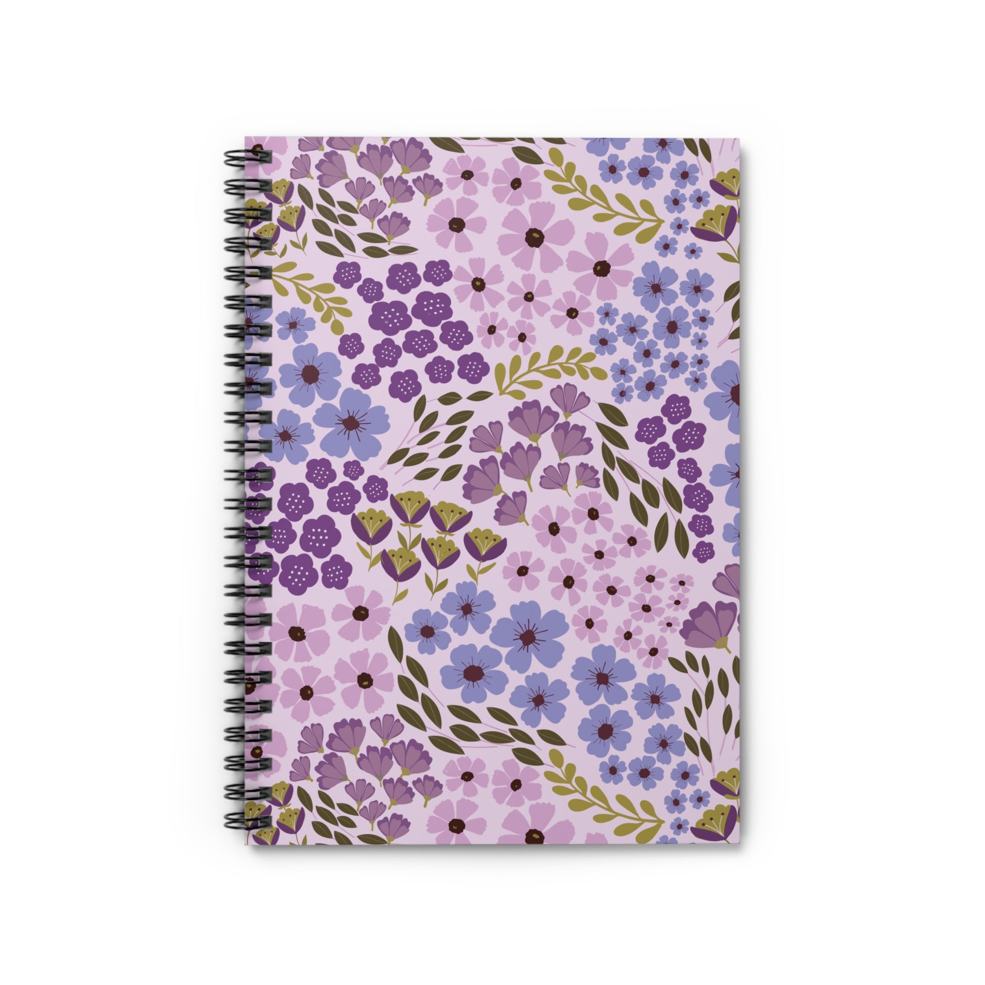 Floral Spiral Notebook featuring a vibrant floral pattern with lavender, purple, and blue hues, accented by olive-green leaves, and a black coil binding, ideal for creative note-taking or journaling.