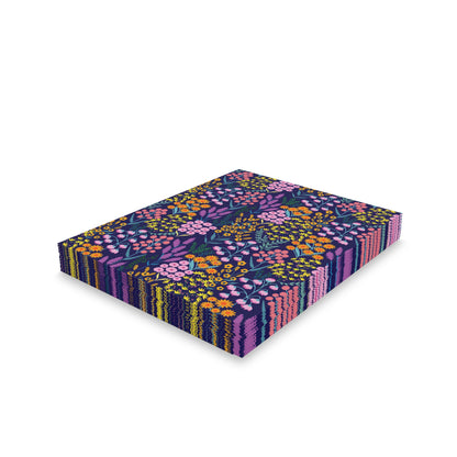 Floral Wildflower Greeting Cards — Pack of 8/16/24, featuring vibrant floral prints on a navy background, stacked to showcase their colorful designs. Each card comes with a matching white envelope, ready for personal messages.