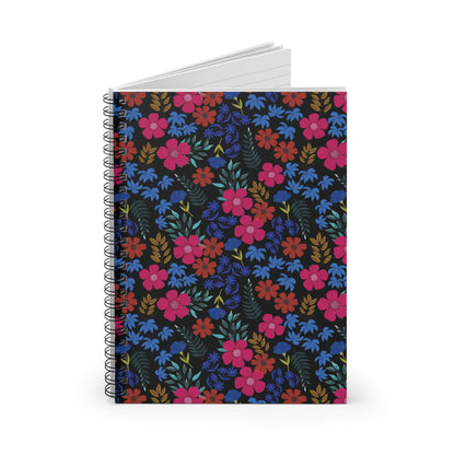 Floral Spiral Notebook with vibrant blossoms, sleek metal binding, stands upright displaying white pages. Perfect for creative tasks; compact, durable design embodies FireBrook Essentials' joyful, uplifting style.