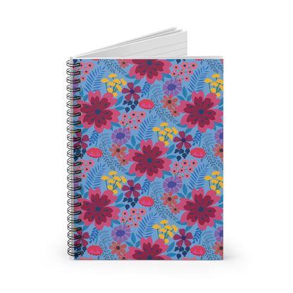 Floral Spiral Notebook with vibrant pink, yellow, and purple flowers on a light blue cover, featuring a sleek metal spiral binding and peek of lined pages, ideal for creative expression and organization.