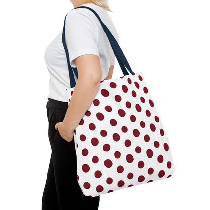Burgundy Polka Dots Tote Bag: A woman displays a stylish and functional tote, showcasing its durable polyester fabric and reinforced handles, perfect for everyday use.
