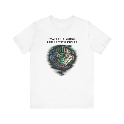 Crocodile: Walk in Silence, Strike with Purpose Bella+Canvas Unisex T-Shirt features a bold crocodile design, symbolizing stealth and strength, on a lightweight, comfortable tee perfect for casual or statement wear.