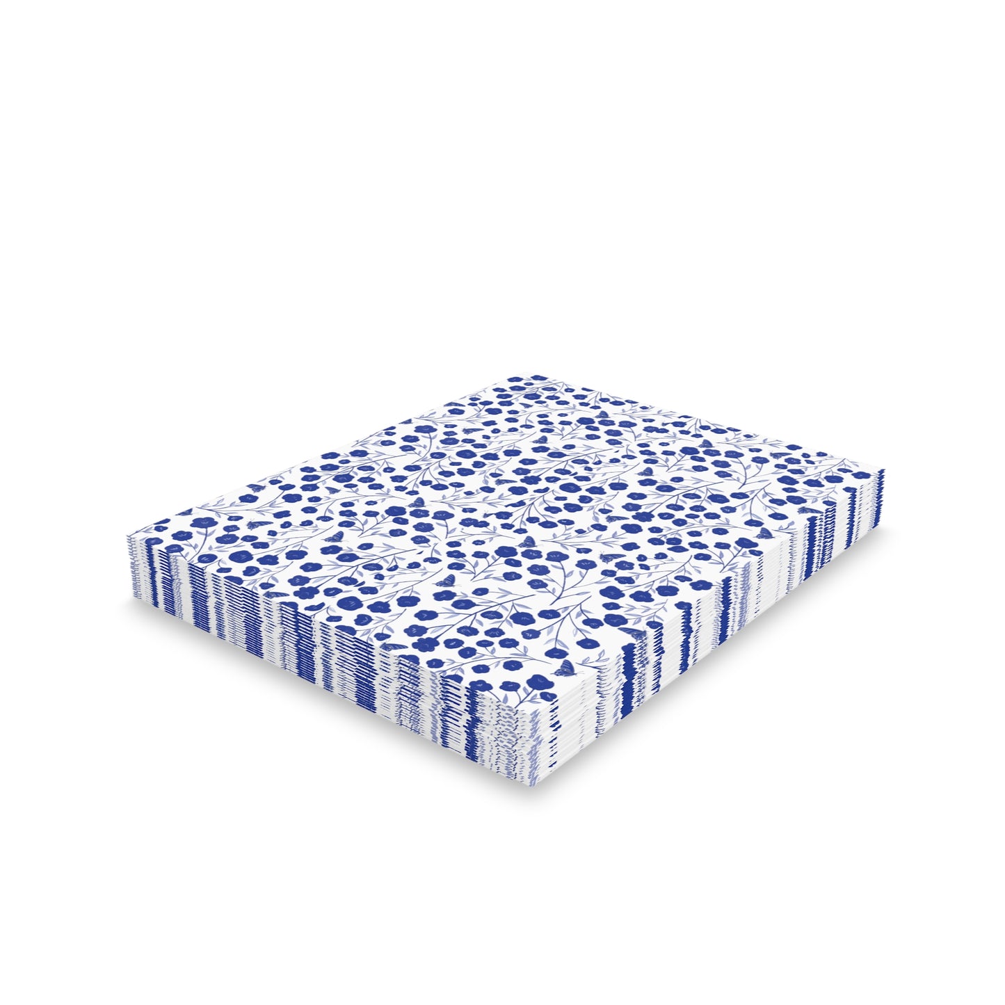 Floral Greeting Cards — Pack of 8/16/24 feature a neat stack of white paper napkins adorned with a small-scale blue floral pattern, ideal for joyful, personal messages.