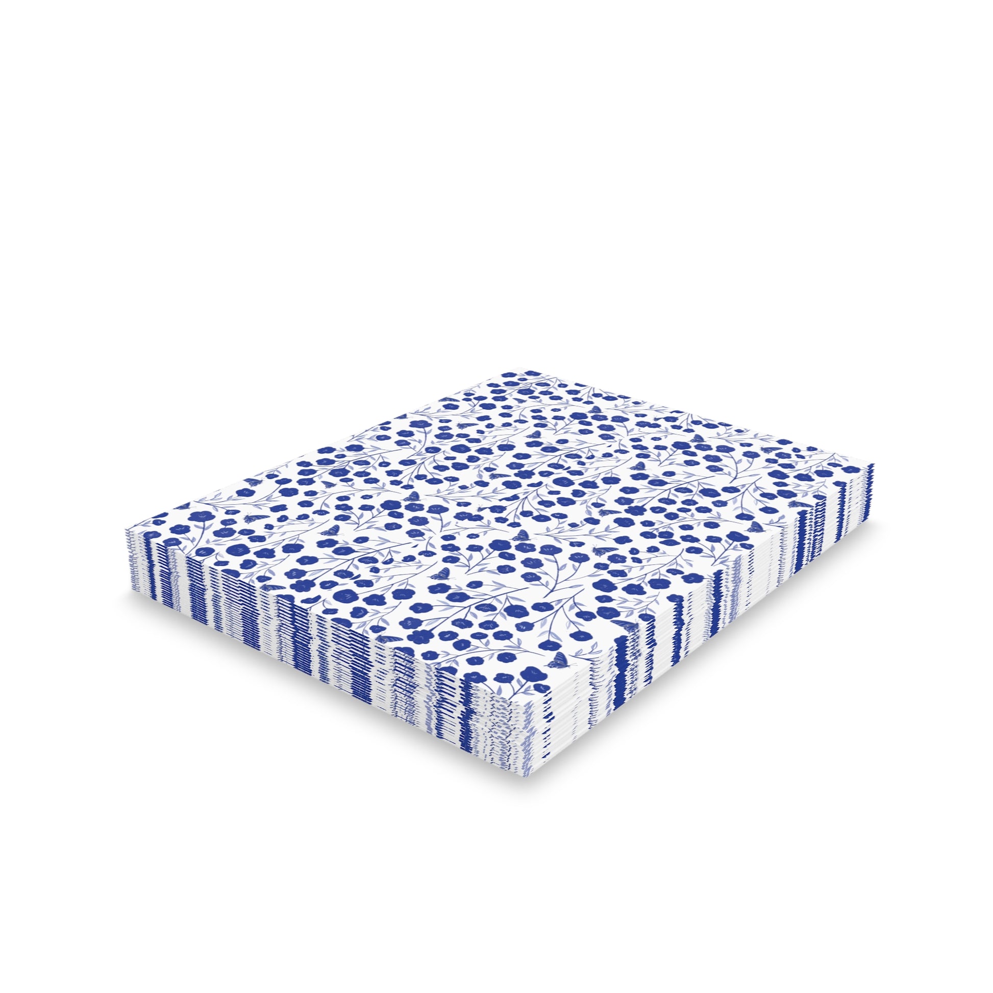 Floral Greeting Cards — Pack of 8/16/24 feature a neat stack of white paper napkins adorned with a small-scale blue floral pattern, ideal for joyful, personal messages.