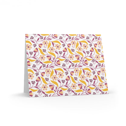 Floral Greeting Cards — Pack of 8/16/24 feature a vibrant floral pattern with blossoms and leaves. Folded and blank inside, these cards include matching envelopes, perfect for heartfelt messages.