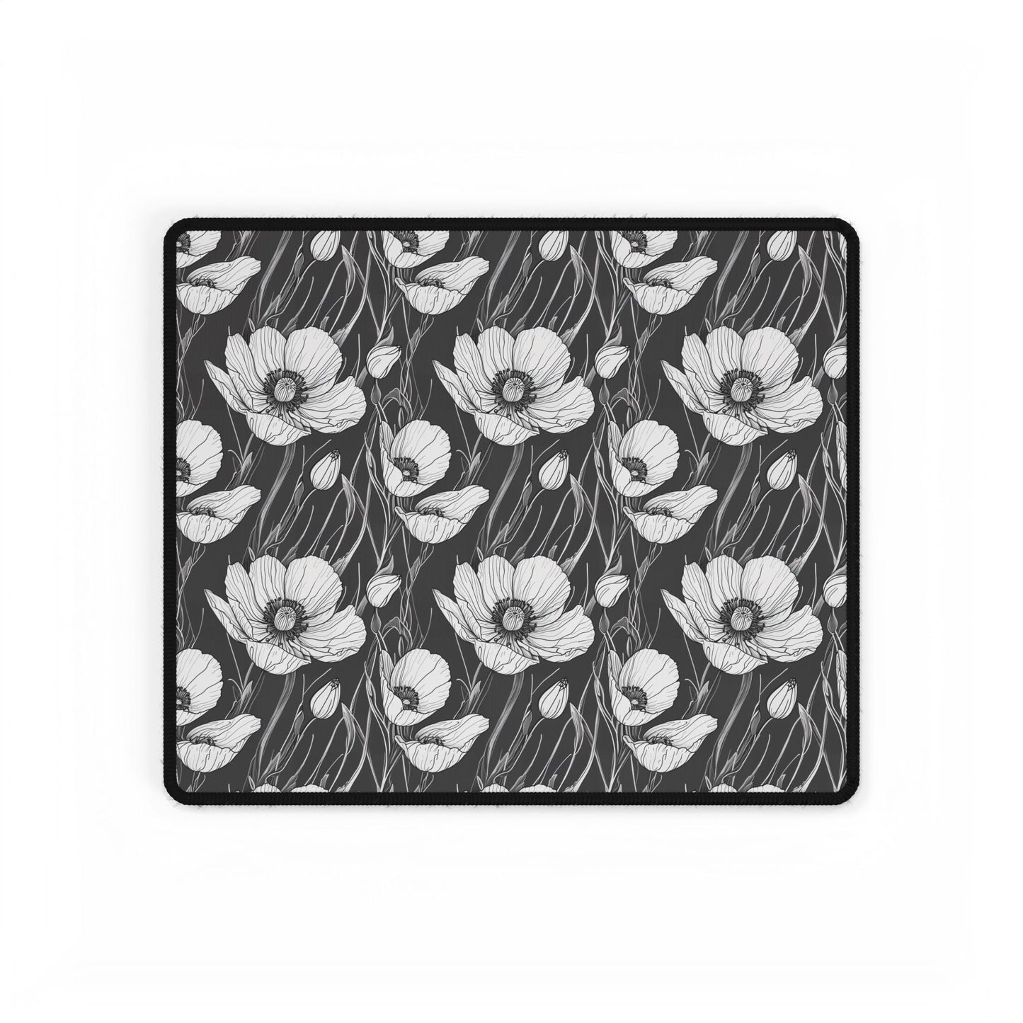 Monochrome Poppies Floral Desk Mat: A detailed black-and-white poppy pattern desk pad, perfect for gifting. Ideal for enhancing workspaces with elegance and style, featuring a smooth, durable surface for easy mouse use.