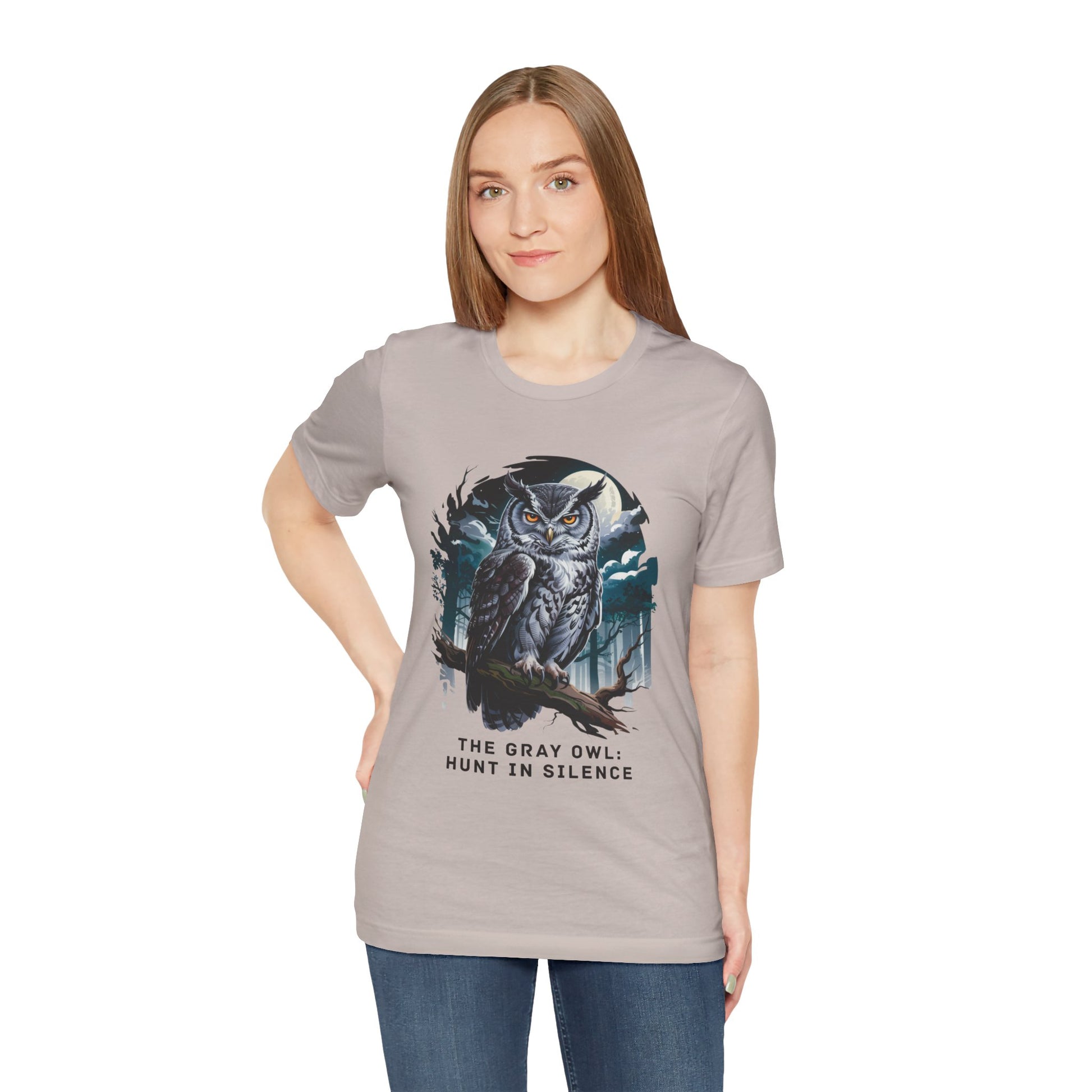 Woman wearing The Gray Owl: Hunt in Silence Bella+Canvas Unisex T-Shirt, featuring an owl print. The tee offers a casual, stylish look, perfect for nature lovers and outdoor activities.