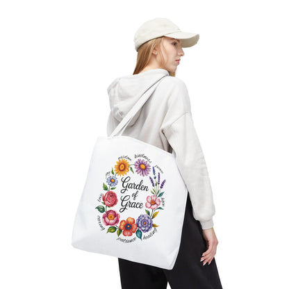 Garden of Grace Watercolor Design Tote Bag features hand-drawn flowers in pastel hues with 'Garden of Grace' text, ideal for nature lovers seeking charm and durability for everyday use.