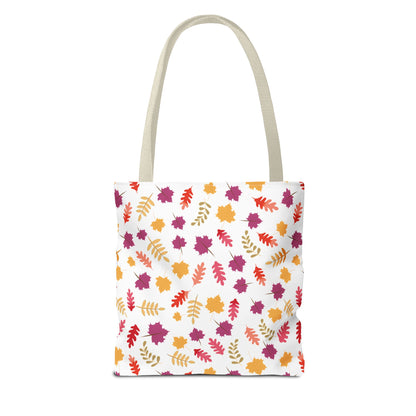 Autumn Leaves Tote Bag showcasing a vibrant pattern of scattered autumn leaves in orange, red, mustard, and plum, features natural-colored handles. Designed for durability with reinforced stitching and boxed corners for added space.