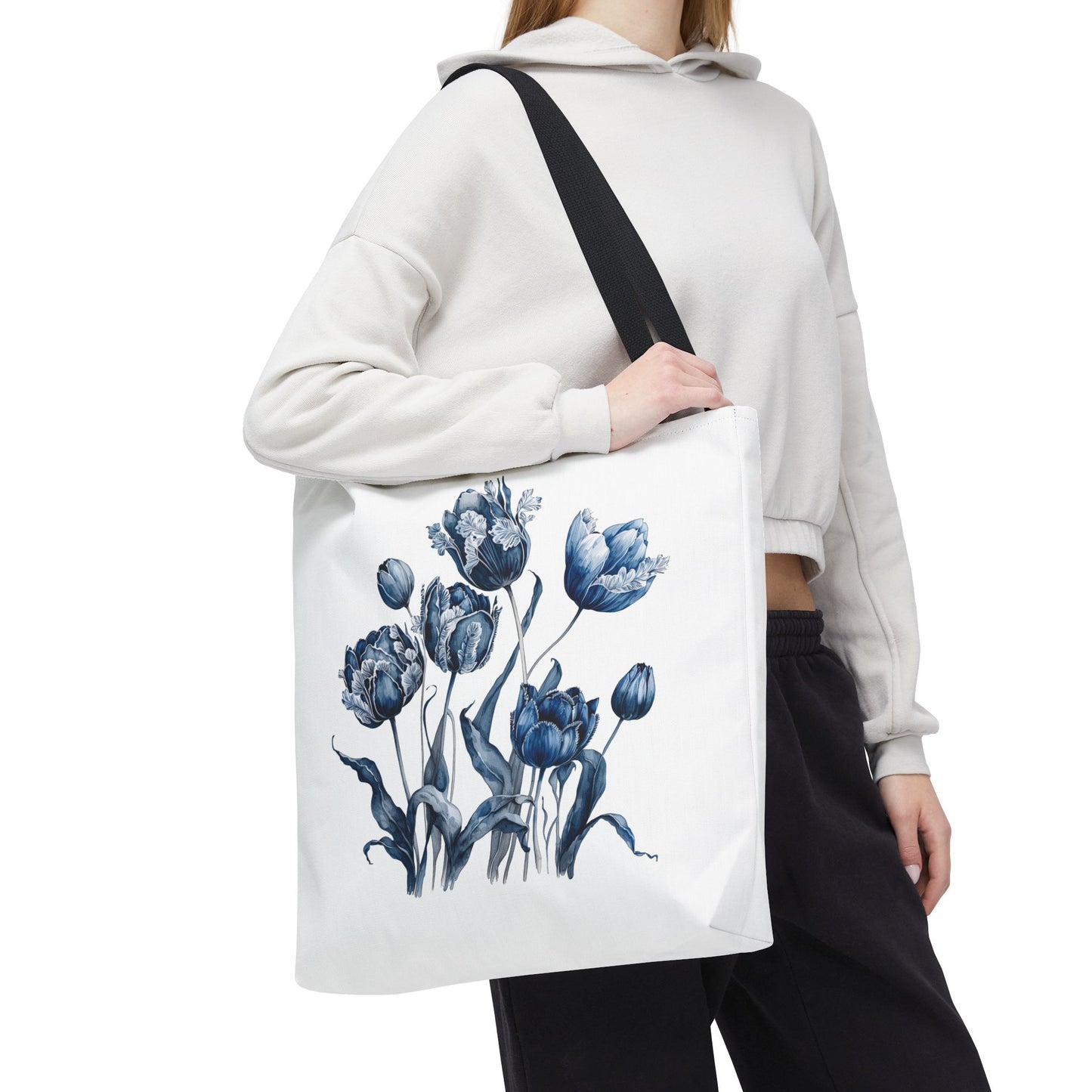 Woman holding the Flowers in Blue Hue Watercolor Tote Bag, showcasing its floral design and durable handles, ideal for everyday use and style.