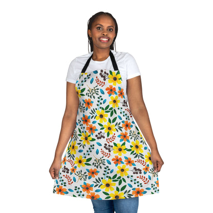 Person wearing a white T-shirt and a Floral Apron with vibrant floral patterns, showcasing its design. The apron is made of soft, stain-free polyester, ideal for various activities, embodying FireBrook Essentials' stylish comfort.