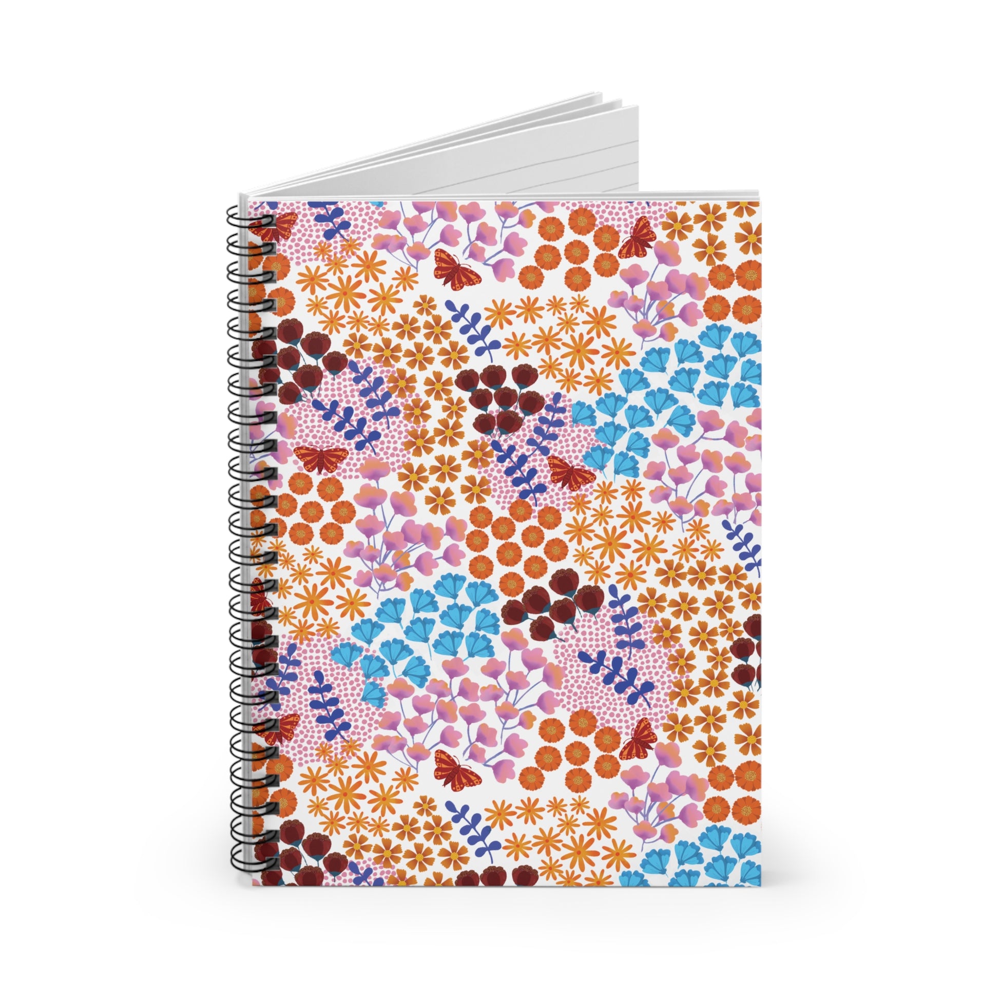 Floral Spiral Notebook featuring a vibrant floral pattern with orange daisies, red buds, and pink blossoms. Its sleek black metal coil binding and unlined white pages are perfect for creative expression.