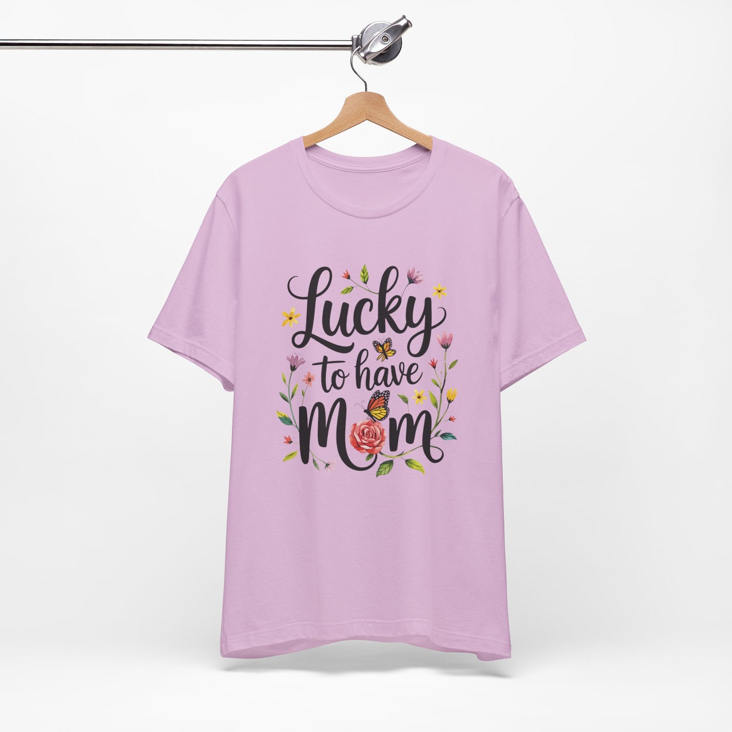 Lucky to Have Mom Mother's Day Bella+Canvas Unisex T-Shirt displayed on a wooden hanger, showcasing its casual, breathable design and 'Lucky to have mom' text on the front.