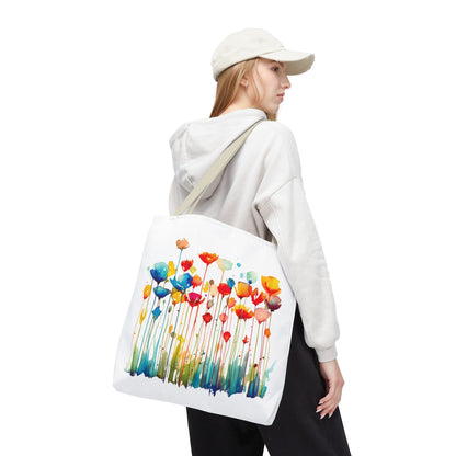 Woman holding Watercolor Floral Tote Bag, featuring a floral painting. Ideal for versatile use, showcasing FireBrook Essentials' blend of style and functionality.