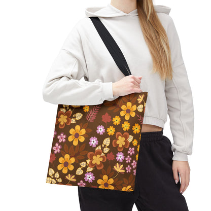 The Floral Tote Bag showcases a retro, autumnal floral pattern with gold, orange, and lilac hues on a dark background, embodying FireBrook Designs' vibrant and joyful aesthetic.