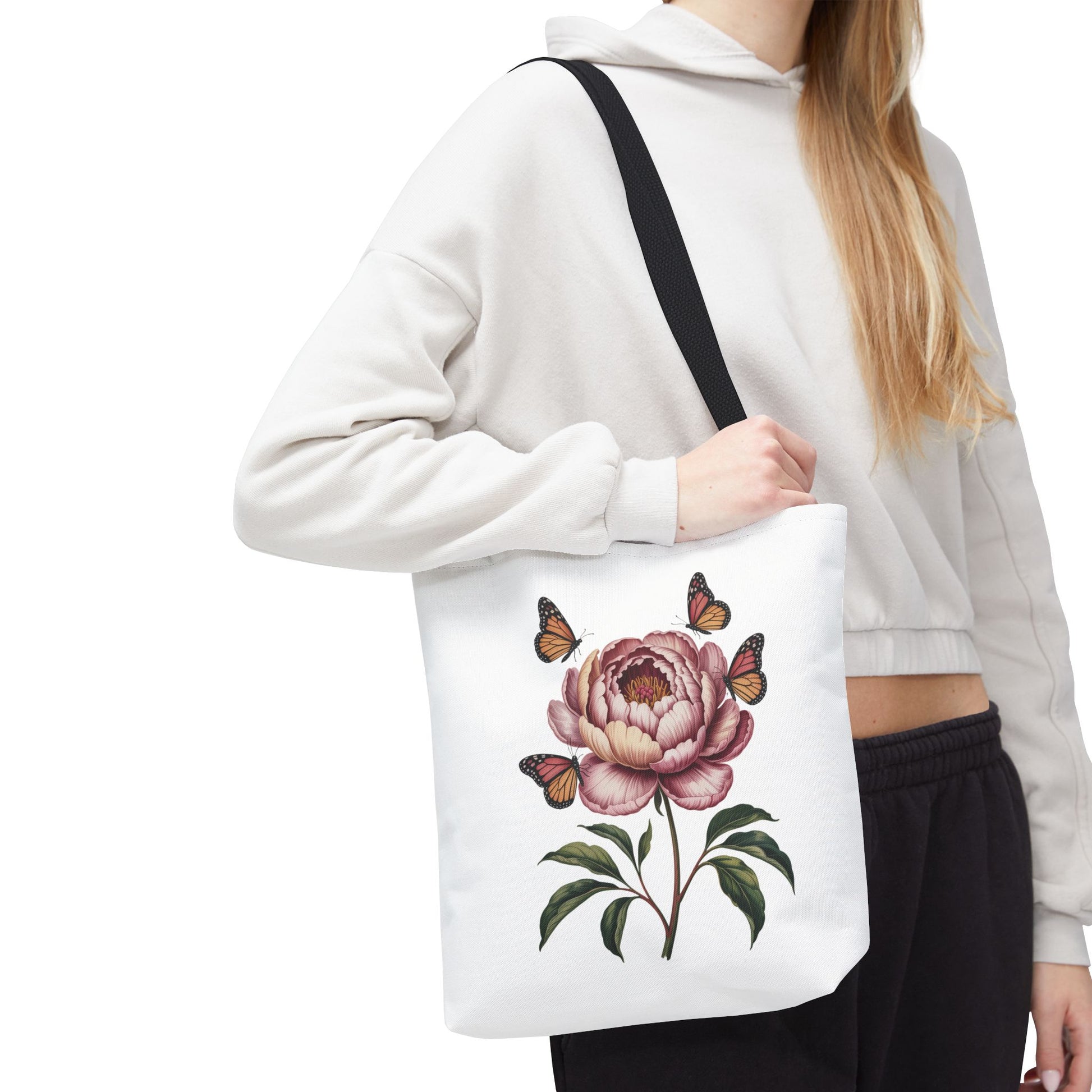 Botanical with Vintage-Inspired Illustration Tote Bag featuring vibrant flowers, intricate leaves, butterflies, and moths. Perfect for nature lovers, with durable polyester, reinforced handles, and available in three sizes.