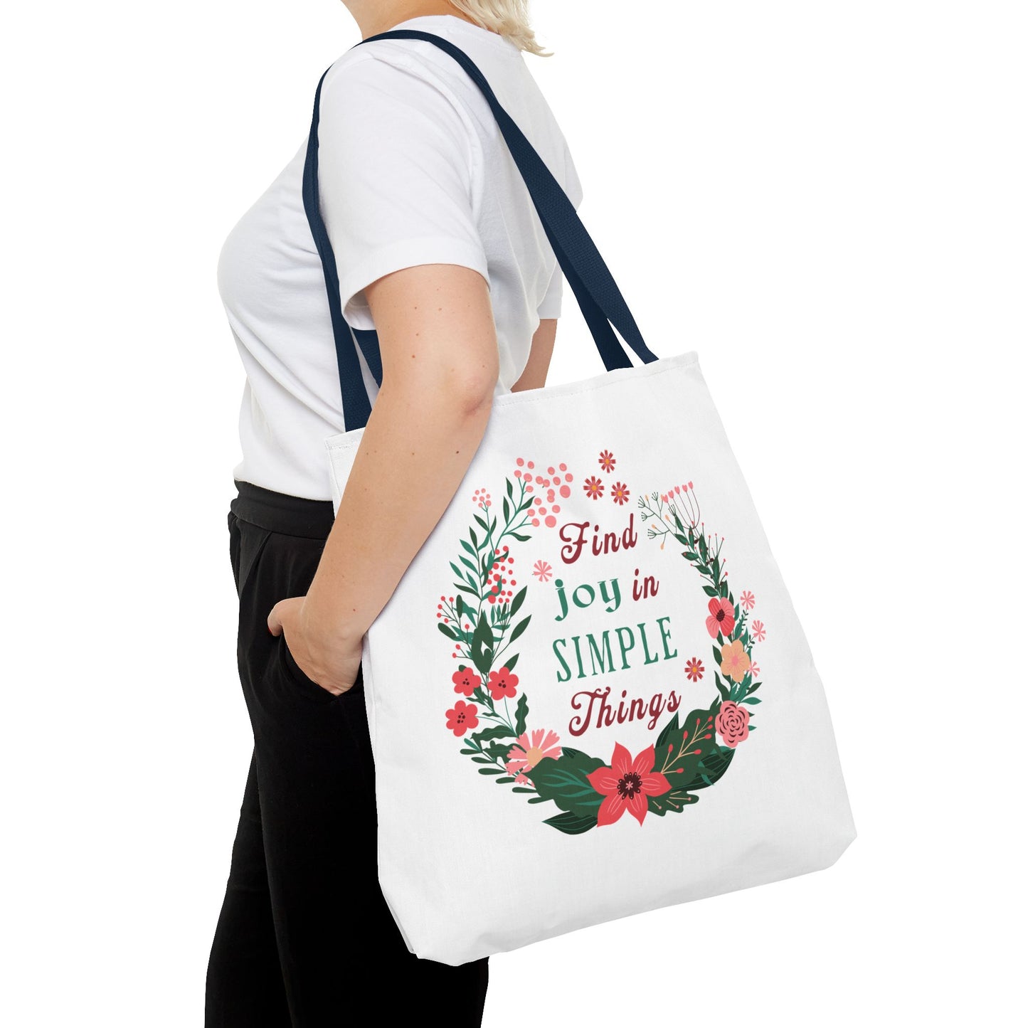 Find Joy in Simple Things Tote Bag with watercolor floral design, held by a woman, showcasing its stylish and functional appeal for everyday use.