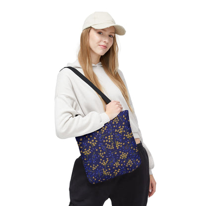 Floral Tote Bag with navy background and botanical print, featuring yellow and blue sprigs. Styled with a black strap, it's ideal for summer, embodying FireBrook Designs' joyful, uplifting spirit.