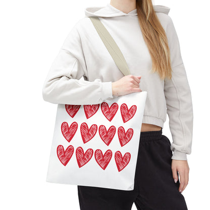 Hearts Tote Bag: A charming white tote adorned with red hearts, seamlessly blending cute design with practicality. Ideal for adding a touch of love to any outfit. Perfect for joyful, everyday use.