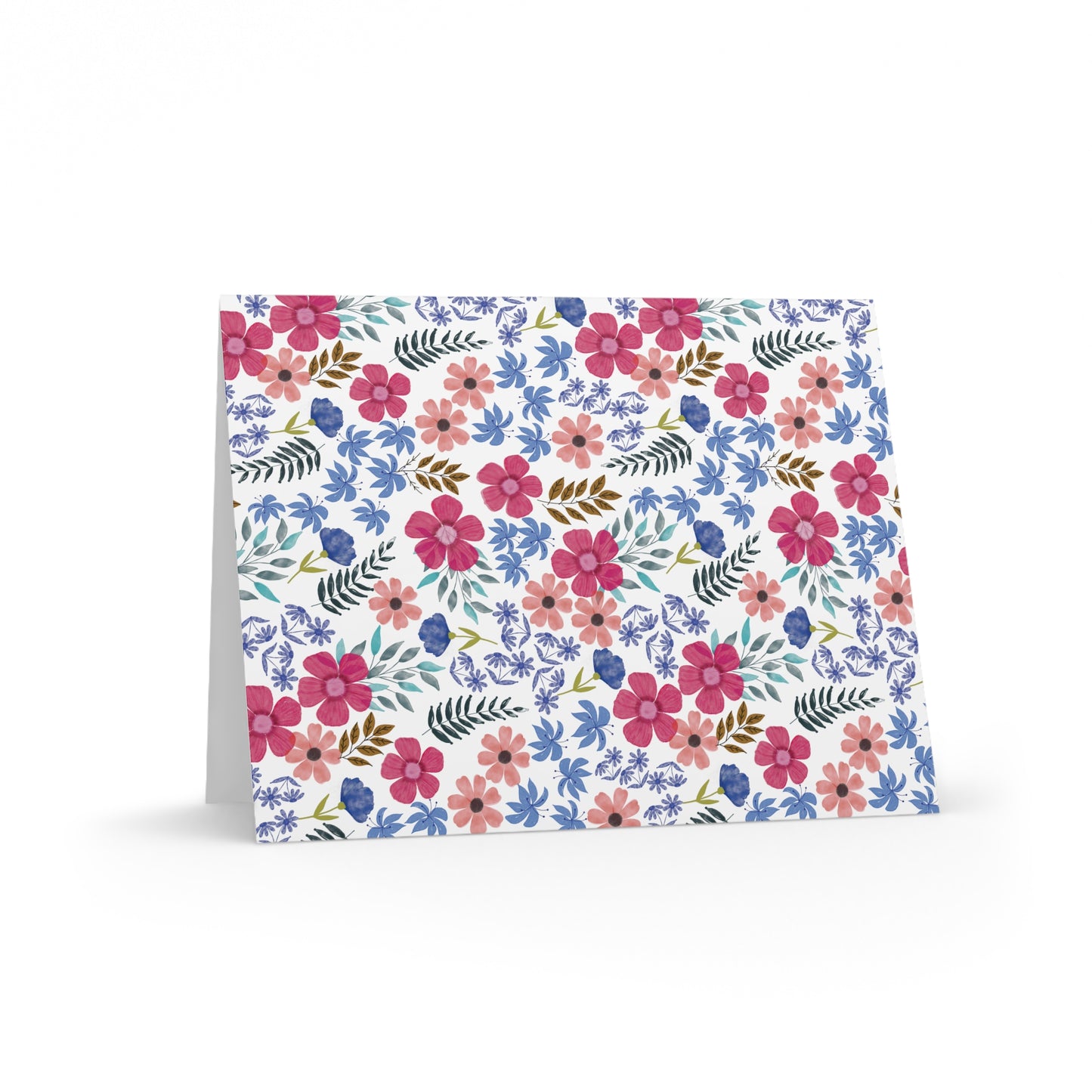 Floral Wildflower Greeting Cards — Pack of 8/16/24, featuring vibrant watercolor-style floral patterns, propped open to reveal a matte finish and matching white envelope, perfect for heartfelt messages.