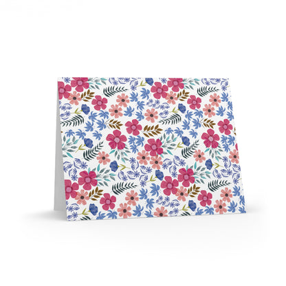 Floral Wildflower Greeting Cards — Pack of 8/16/24 feature a vibrant watercolor-style floral pattern with pink, coral, and blue blossoms, offering a cheerful, garden-inspired design on a matte-finish card.
