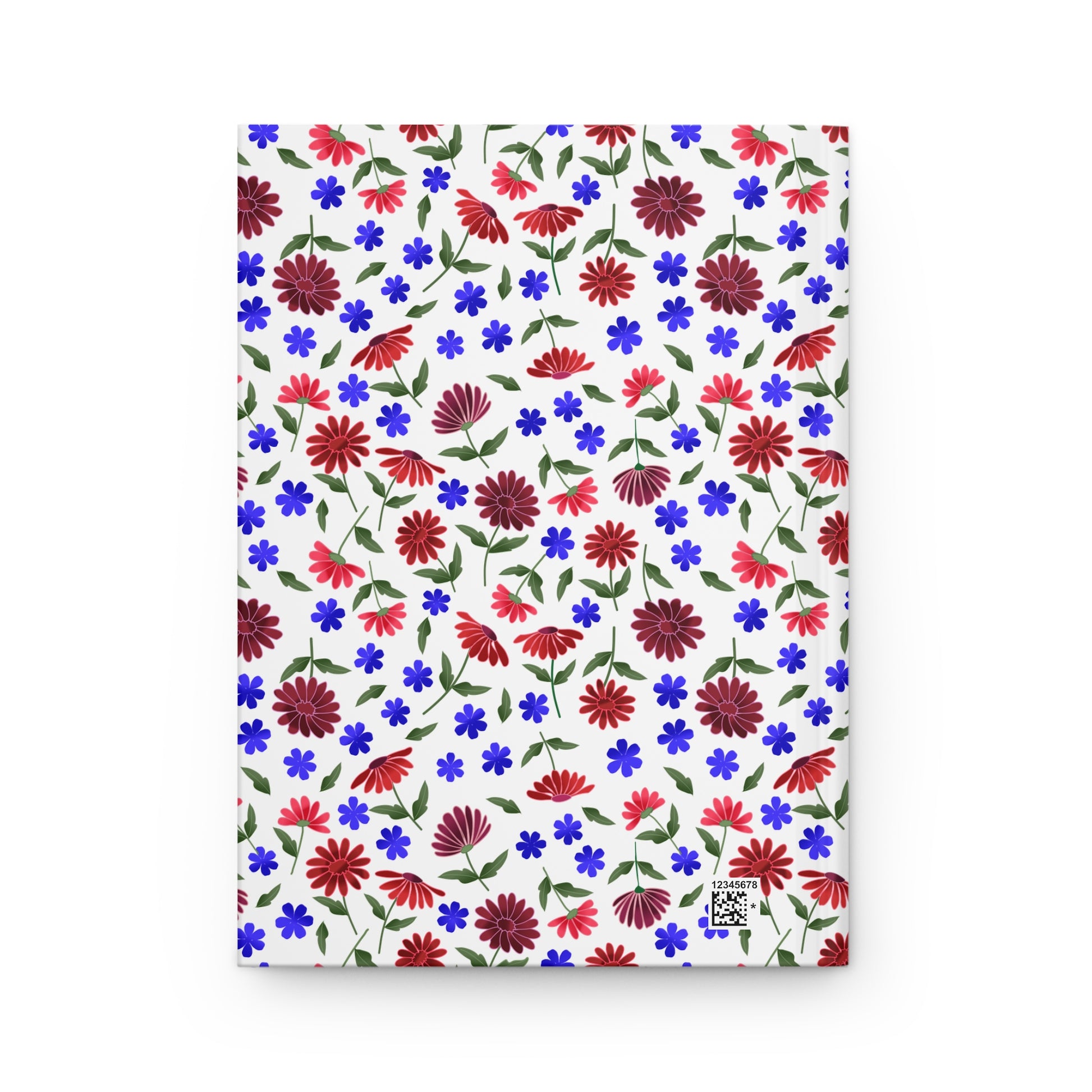 Floral Ditsy Hardcover Journal — Red & Blue Wildflower Notebook features a vibrant floral pattern of red daisies and blue blossoms on a white matte cover, embodying FireBrook Designs' uplifting style.