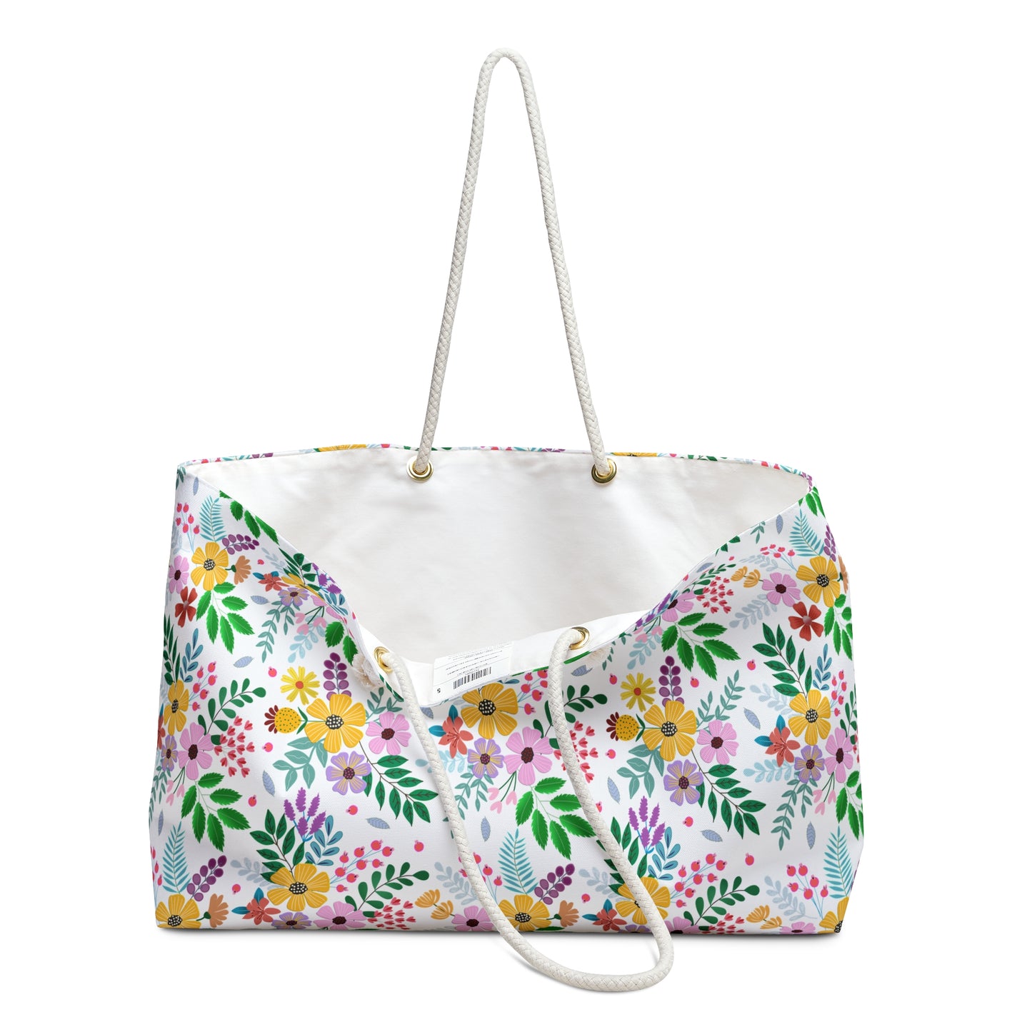 Weekender Bag featuring a vibrant floral pattern on white canvas with sturdy rope handles and a spacious, plain interior, perfect for stylish travel.