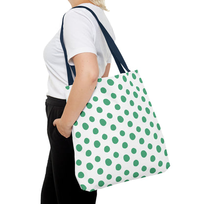 Green Polka Dots Tote Bag held by a woman, showcasing its cheerful design and durable 100% polyester material, ideal for adding a pop of color to spring and summer outfits.