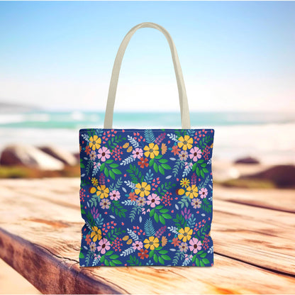Deep Sea Floral Patch Tote Bag on wooden surface, featuring vibrant multicolored blossoms and off-white handles. Perfect for summer outings, this FireBrook Designs bag combines joyful style and practicality.