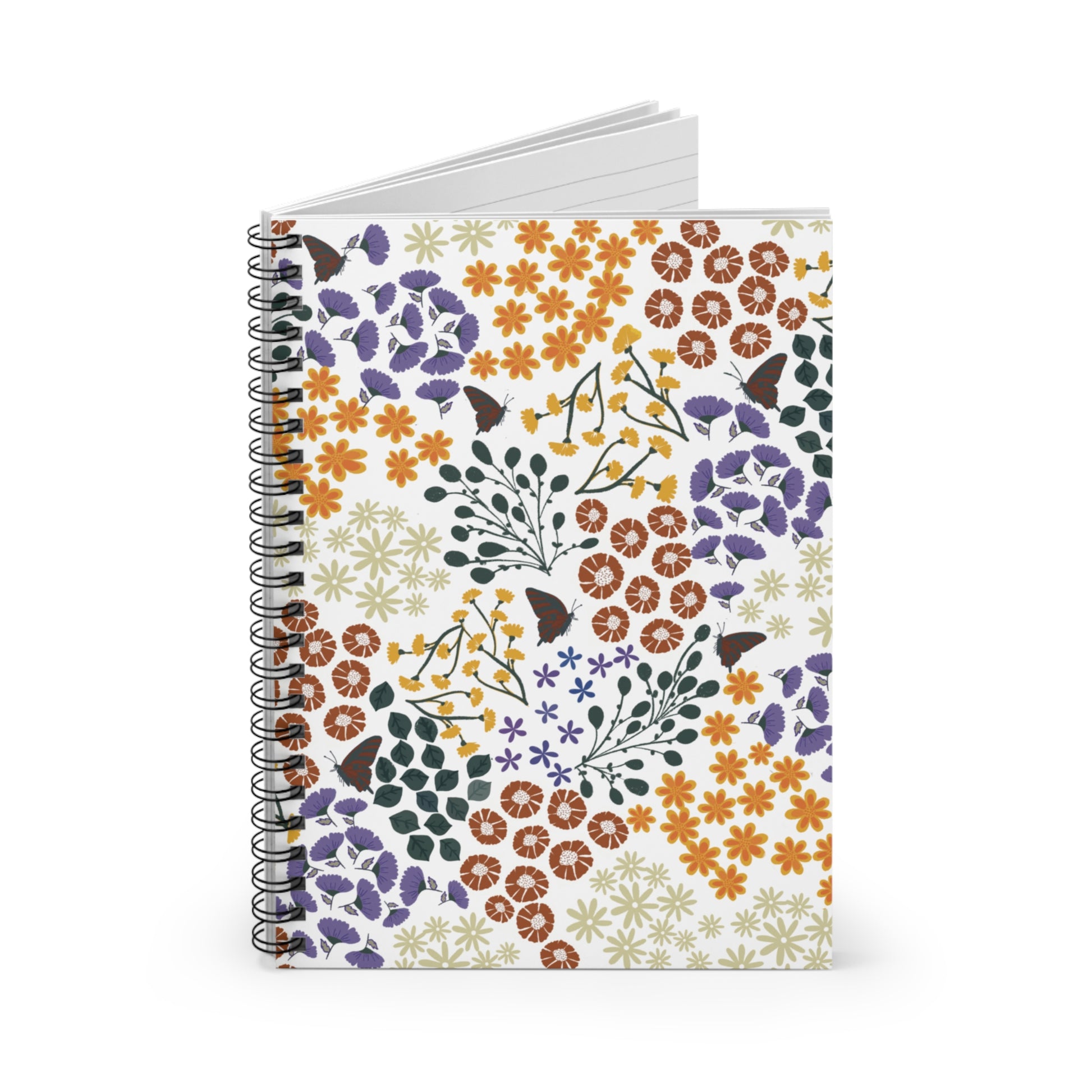 Floral Spiral Notebook with vibrant orange, rust-brown, yellow, and purple flowers, and green leaves. Standing upright, slightly open, showcasing blank pages. Ideal for creative journaling and daily notes.
