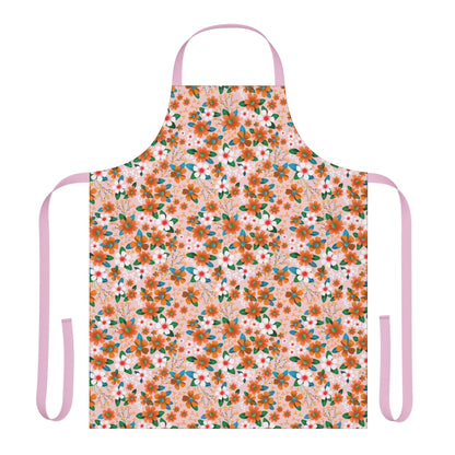 Floral Apron featuring orange and white blossoms with green leaves on a pale pink background, complete with long pink ties, embodies FireBrook Essentials' commitment to stylish, comfortable, and practical design.